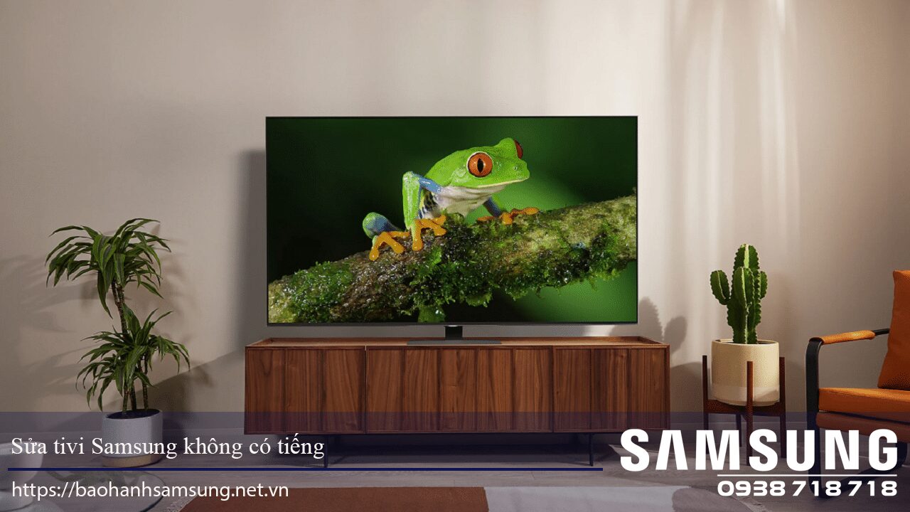 Brightly lit living room with a flat-screen Samsung TV displaying a colorful frog on a branch, complemented by potted plants and modern furniture in a cozy, stylish space.
