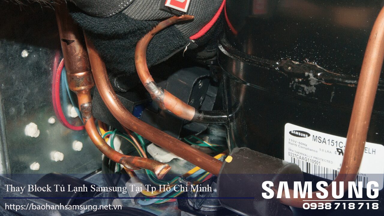 Copper refrigeration pipes inside Samsung refrigerator compressor unit.